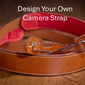 Rich brown camera strap with shoulder pad and tabs