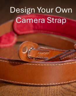 Rich brown camera strap with shoulder pad and tabs